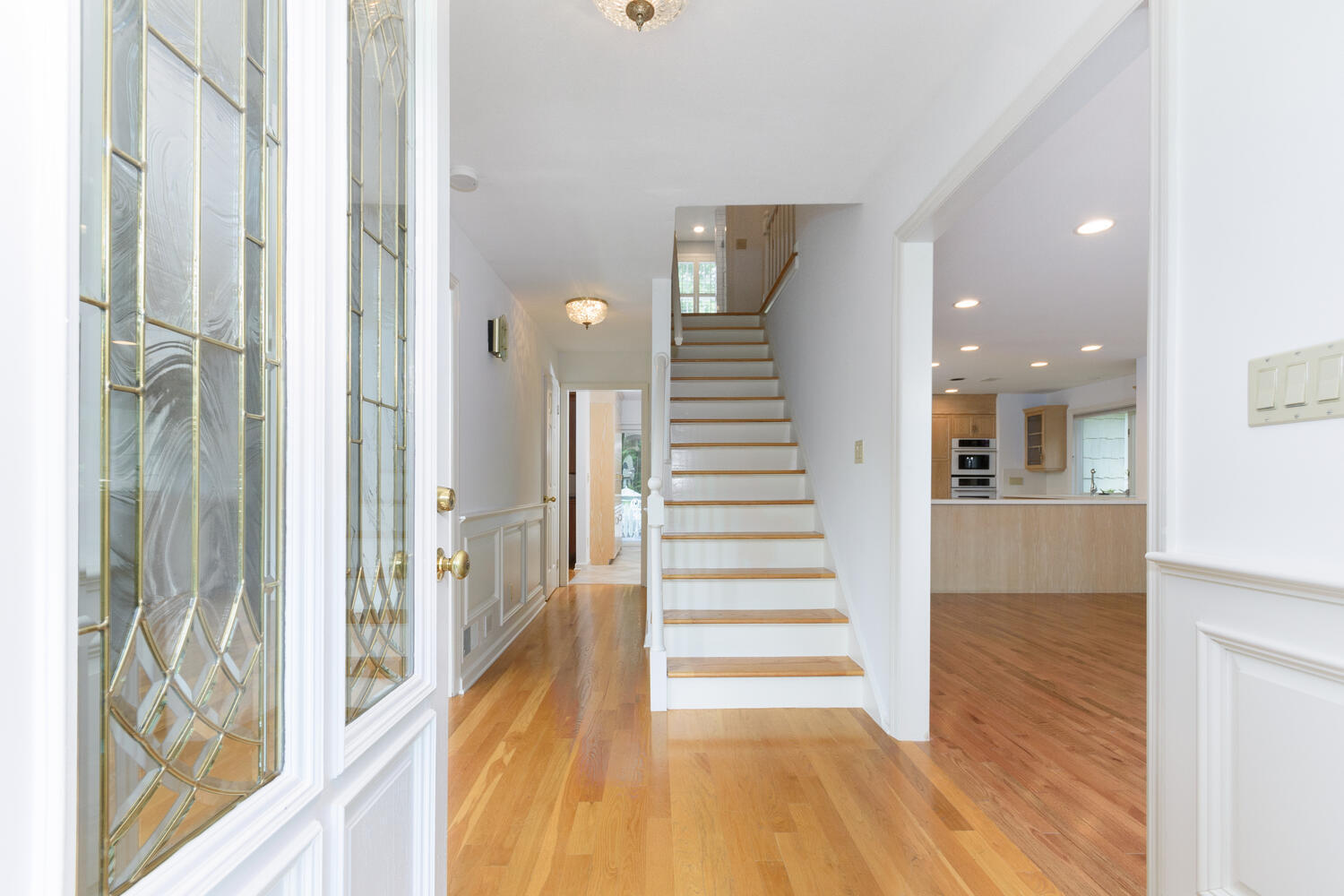 32 Barringer Road Darien, CT 06820 - Photo 3 of 28 a view of a hallway with wooden floor and staircase