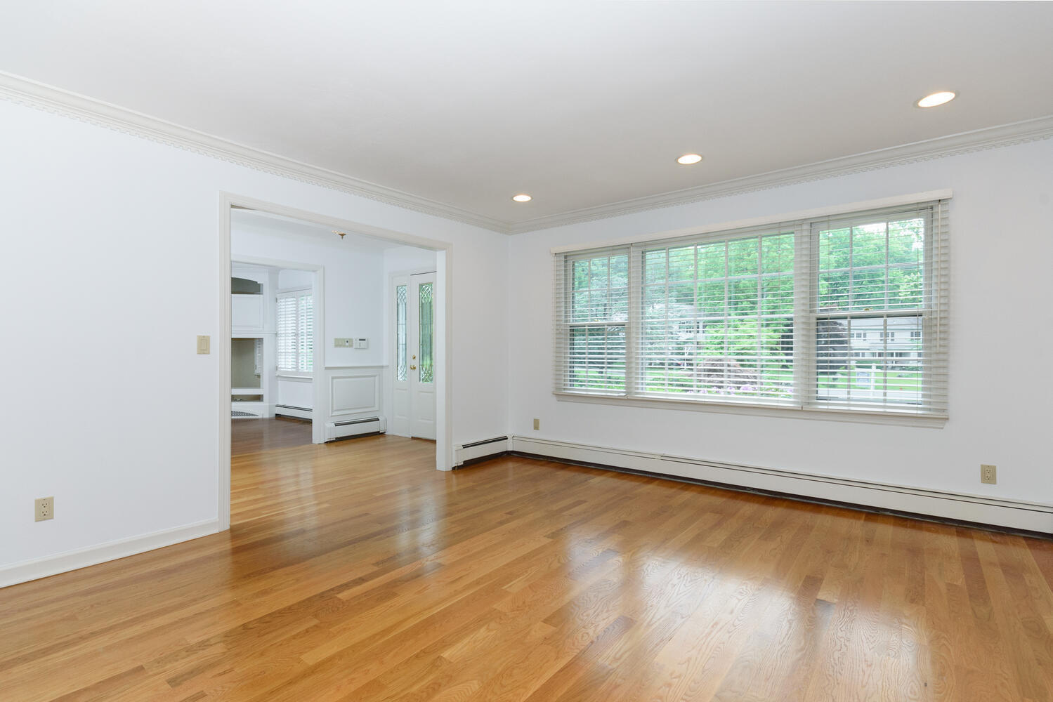 32 Barringer Road Darien, CT 06820 - Photo 5 of 28 an empty room with wooden floor and windows