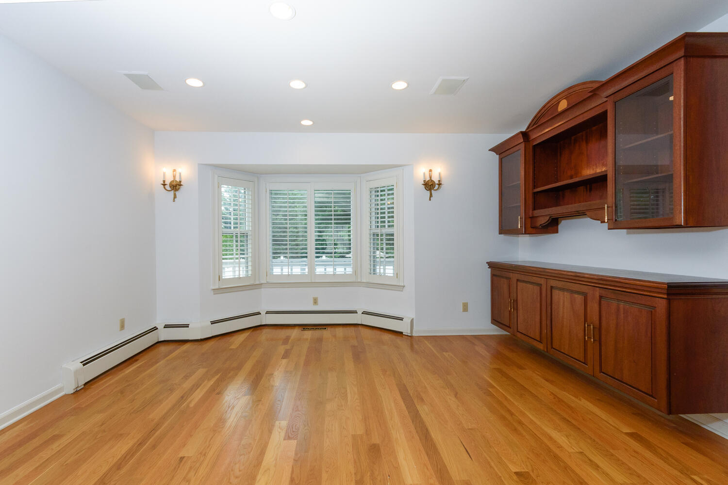 32 Barringer Road Darien, CT 06820 - Photo 8 of 28 a view of an empty room with a window and wooden floor