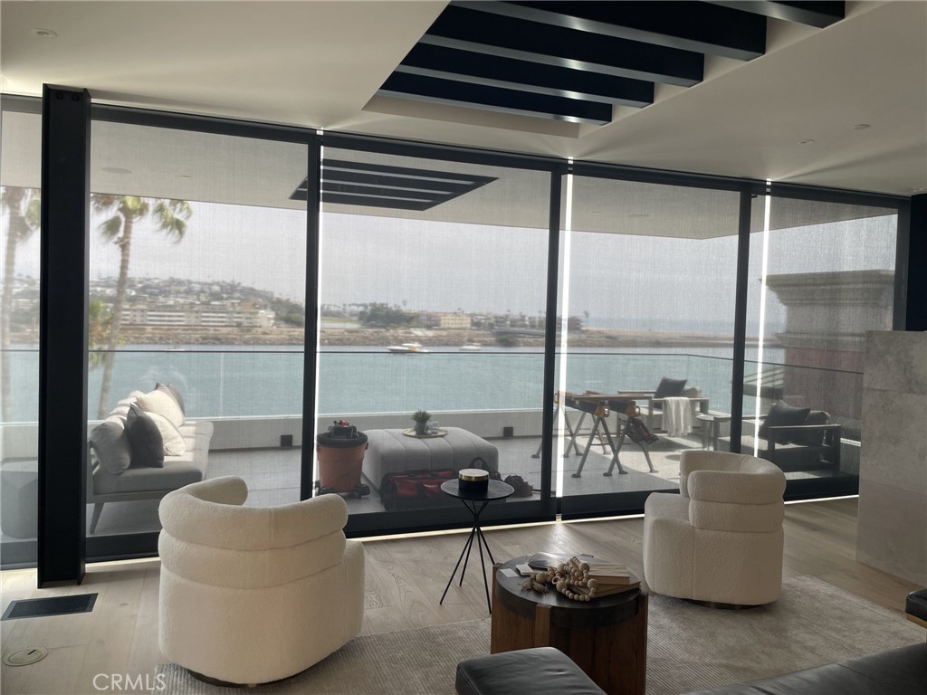 115 Via Marina Marina del Rey, CA 90292 - Photo 8 of 14 a living room with furniture and a floor to ceiling window