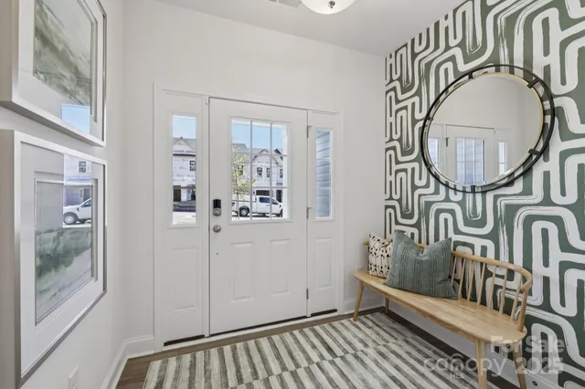 a view of an entryway with wooden floor