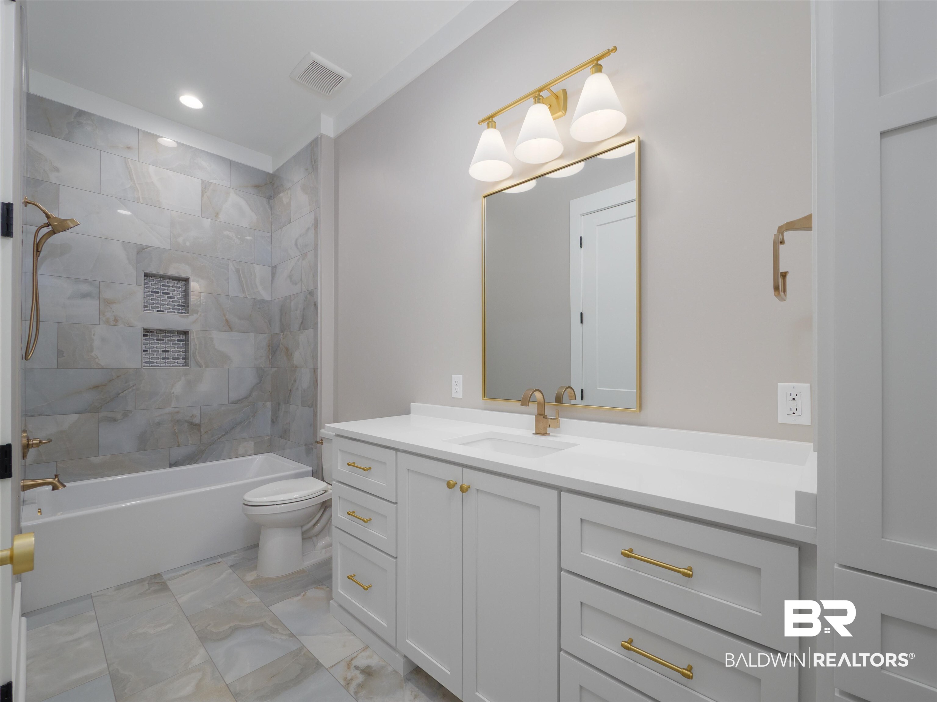 10912 Catania Avenue Fairhope, AL 36532 - Photo 30 of 54 This bathroom has two doors that service the second bedroom and the hallway off the living area