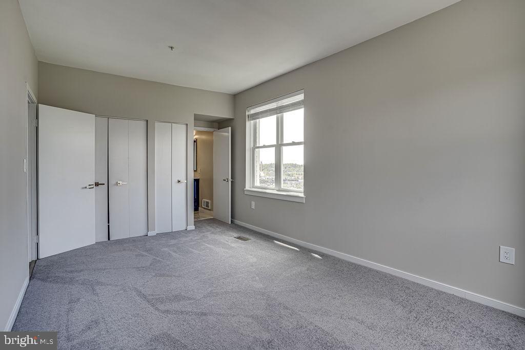 301 South Reynolds Street, Unit 607 Alexandria, VA 22304 - Photo 9 of 16 a view of an empty room with a window