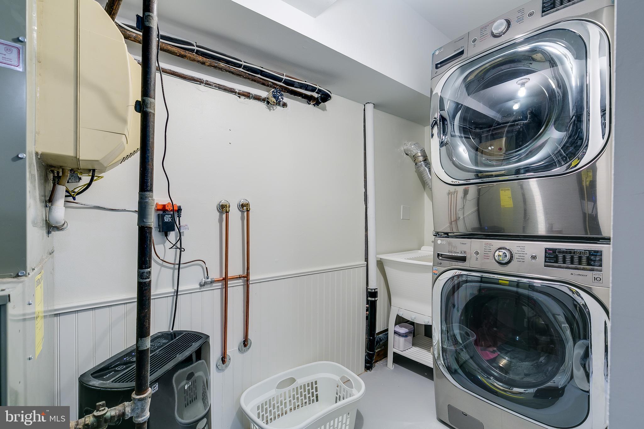 1589 Inlet Court Reston, VA 20190 - Photo 25 of 36 Front loading washer/dryer + laundry tub