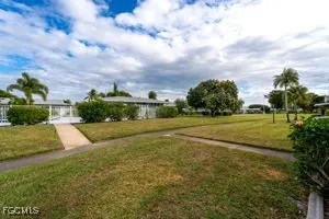 a view of a dinning room with furniture window and outside view