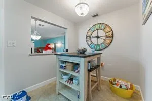 a view of a dining room with furniture and window