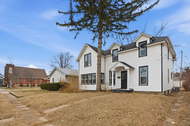 a front view of a house with a yard