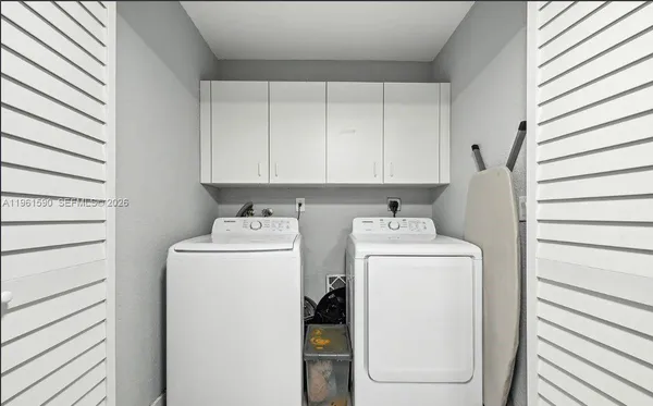 a utility room with dryer and washer