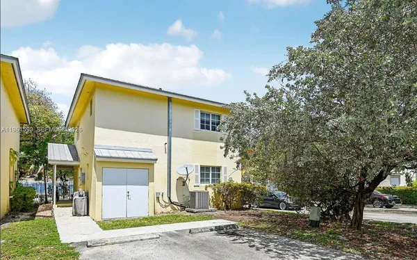 a front view of house with street