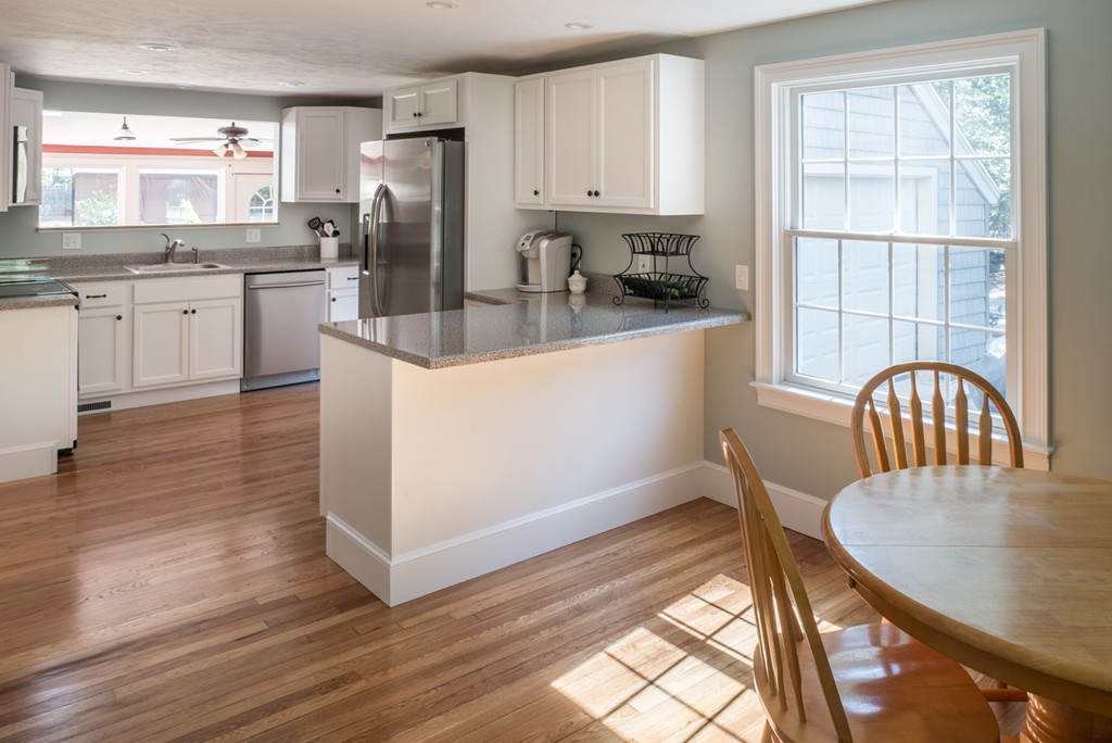 51 Pole Plain Road Sharon, MA 02067 - Photo 2 of 9 a kitchen with granite countertop a stove a sink a refrigerator and wooden floors