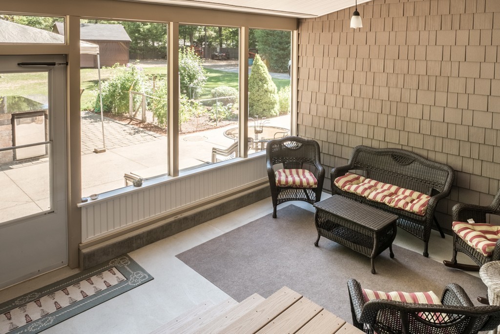 51 Pole Plain Road Sharon, MA 02067 - Photo 7 of 9 a bench sitting in front of a building