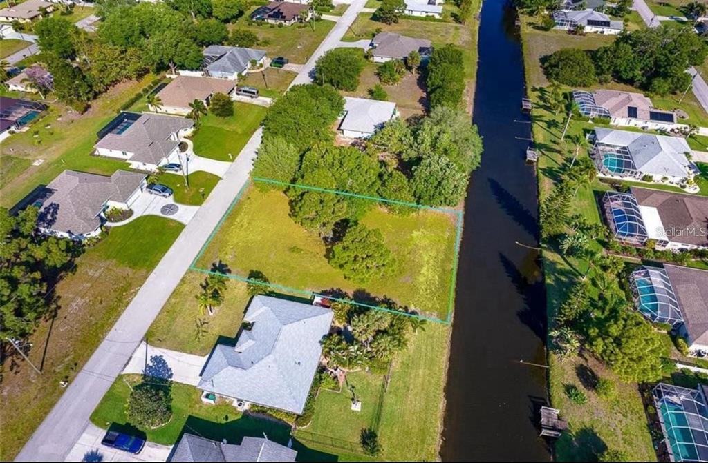 74 Mariner Lane Rotonda West, FL 33947 - Photo 3 of 7 an aerial view of residential houses with outdoor space