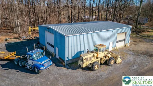a view of backyard with deck and seating area