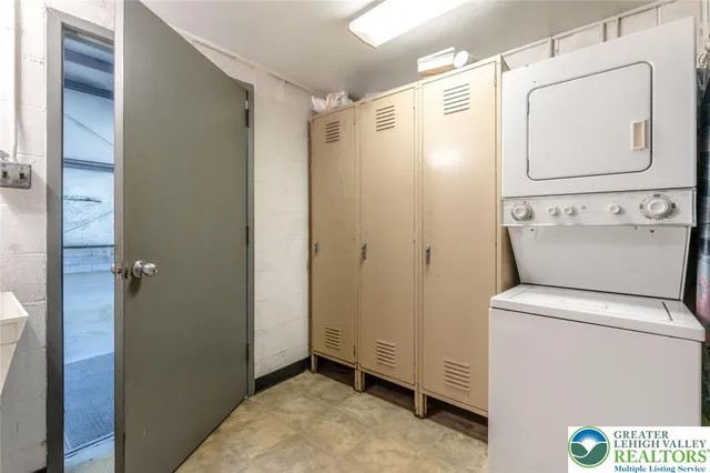 a bathroom with a shower and a sink