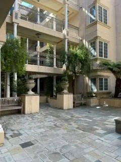 a large kitchen with a large counter top appliances and cabinets