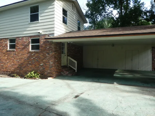 a view of backyard with a small cabin