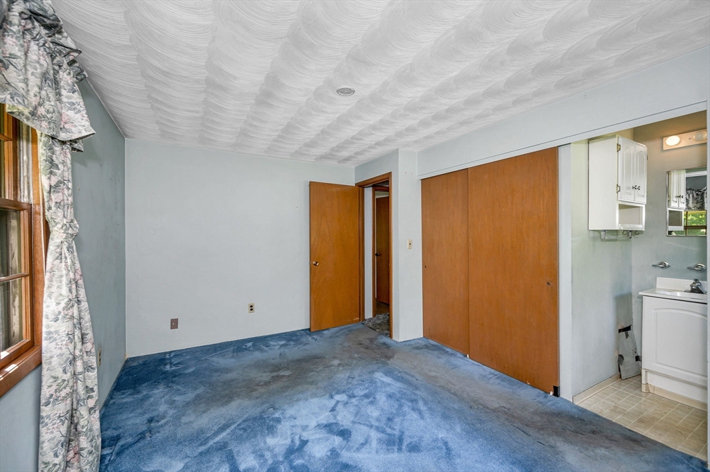 13 Judith Road Chelmsford, MA 01824 - Photo 15 of 36 a view of empty room with wooden floor and fan