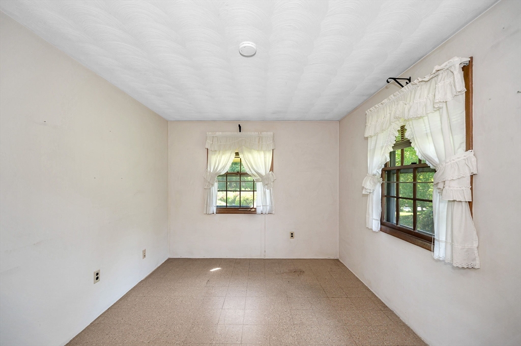 13 Judith Road Chelmsford, MA 01824 - Photo 18 of 36 an empty room with windows