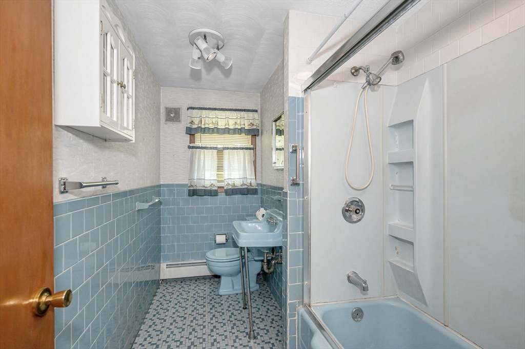 13 Judith Road Chelmsford, MA 01824 - Photo 25 of 36 a bathroom with a granite countertop sink a toilet and shower