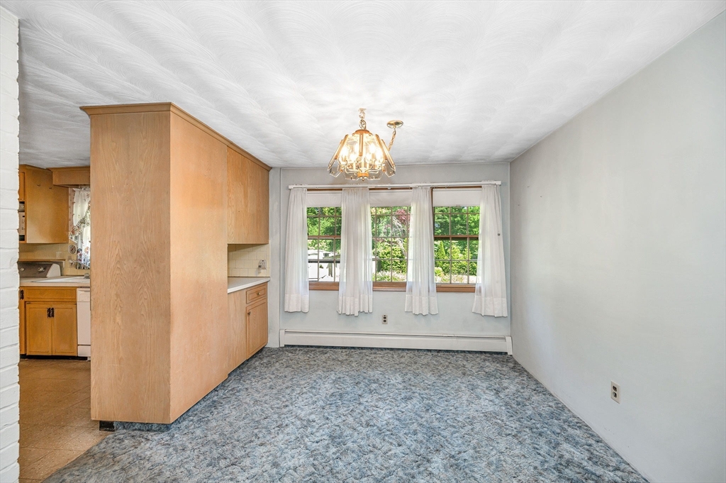 13 Judith Road Chelmsford, MA 01824 - Photo 8 of 36 an empty room with windows and entrance