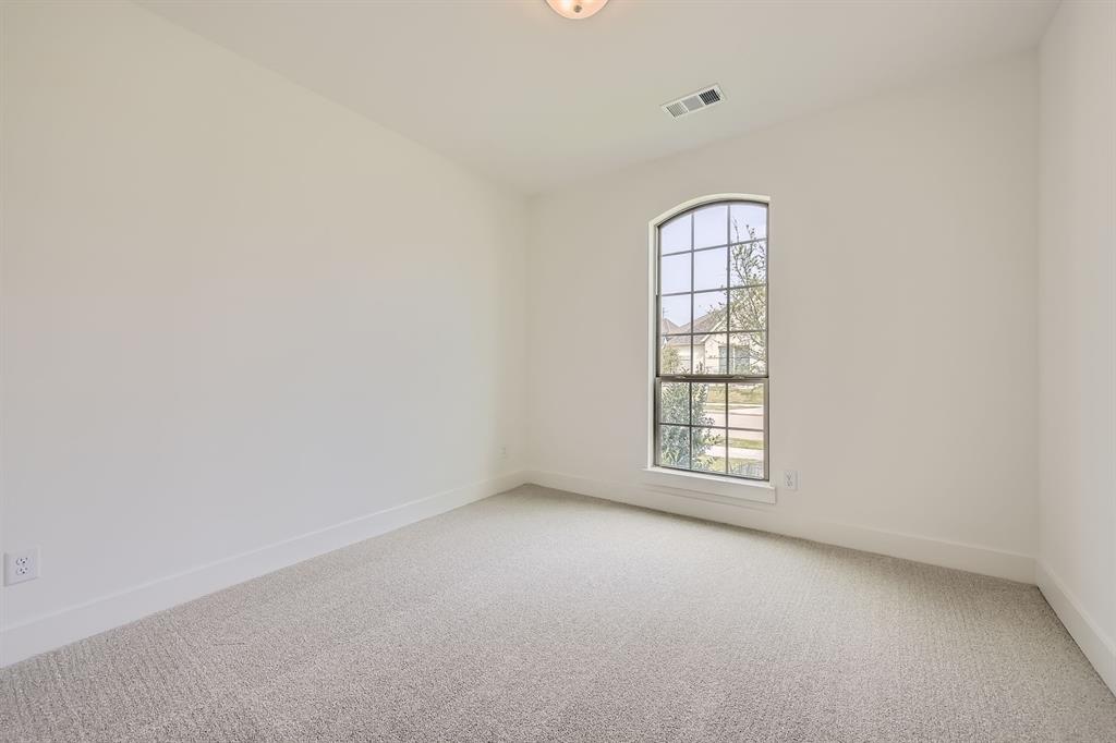167 Sandie Drive Rhome, TX 76078 - Photo 20 of 29 Empty room with light carpet and baseboards