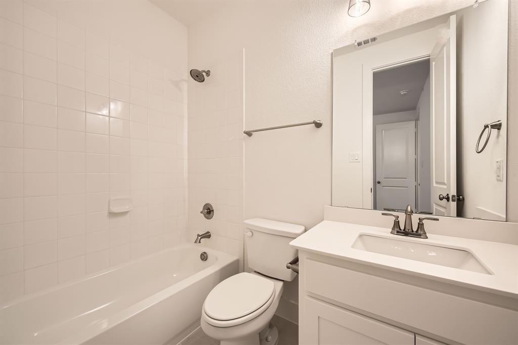 167 Sandie Drive Rhome, TX 76078 - Photo 22 of 29 Bathroom with toilet, shower / bathtub combination, and vanity