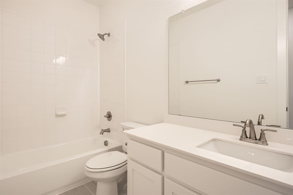 167 Sandie Drive Rhome, TX 76078 - Photo 23 of 29 Full bath featuring toilet, bathing tub / shower combination, and vanity