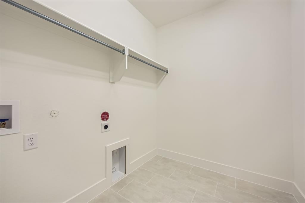 167 Sandie Drive Rhome, TX 76078 - Photo 24 of 29 Laundry area featuring hookup for an electric dryer, washer hookup, baseboards, and gas dryer hookup