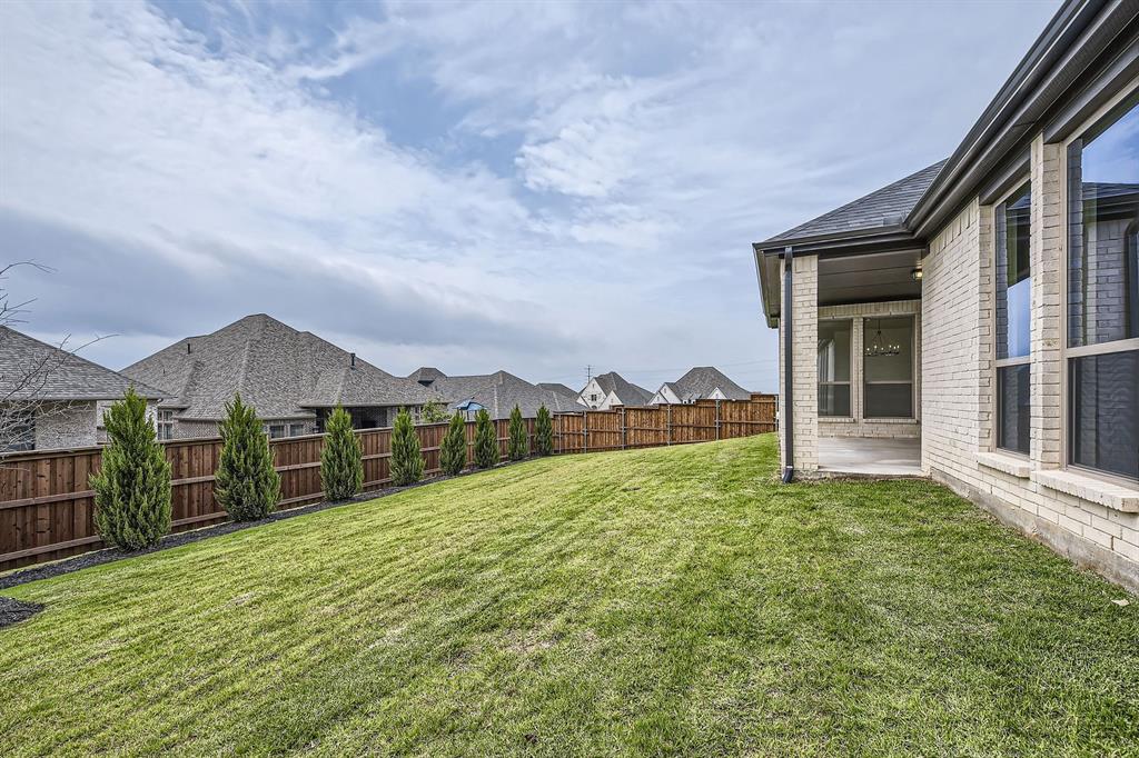 167 Sandie Drive Rhome, TX 76078 - Photo 28 of 29 View of yard featuring a patio