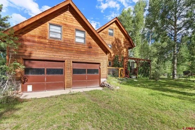 a view of balcony with wooden floor and outdoor seating