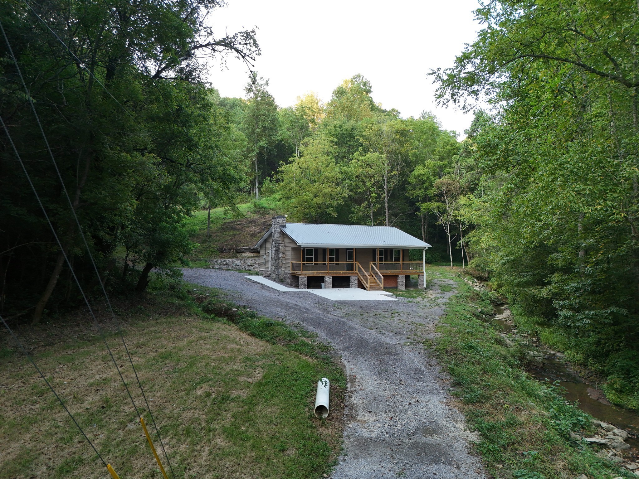 778 Jones Hollow Road Woodbury, TN 37190 - Photo 2 of 19 a view of a house with a big yard and large trees