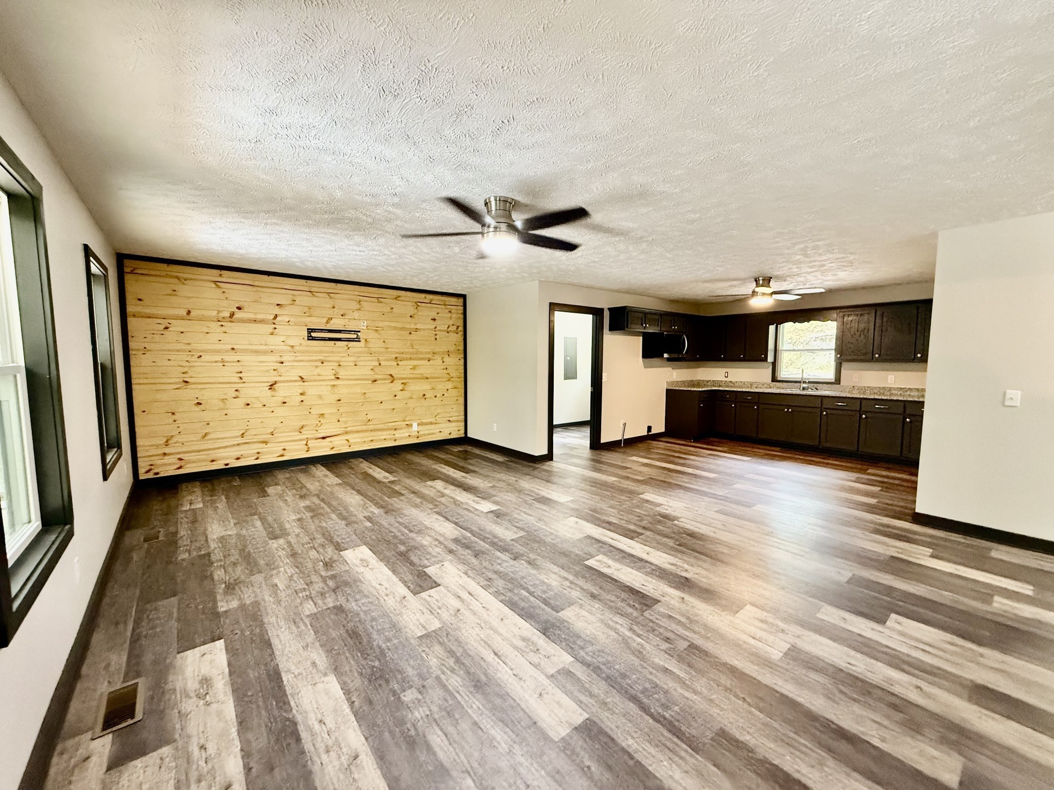 778 Jones Hollow Road Woodbury, TN 37190 - Photo 4 of 19 a view of a room with kitchen appliances and a ceiling fan