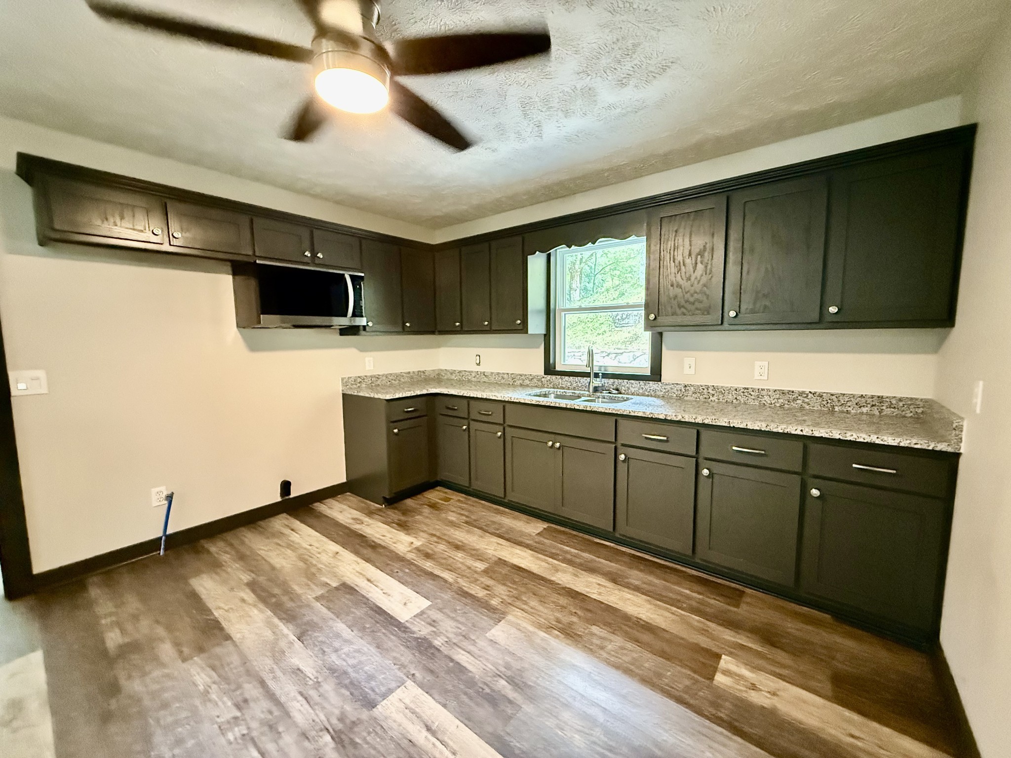 778 Jones Hollow Road Woodbury, TN 37190 - Photo 8 of 19 a kitchen with a sink appliances and cabinets