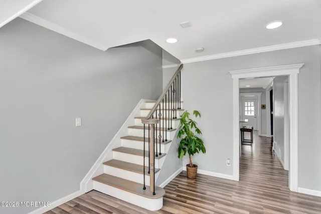 a view of entryway with wooden floor