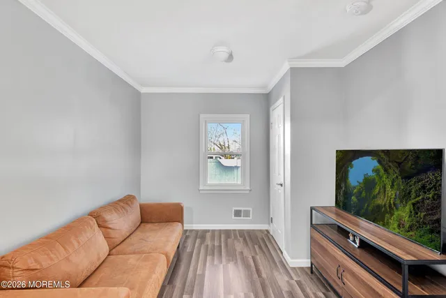 a living room with furniture fireplace and flat screen tv