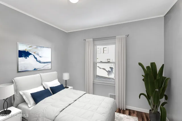 a bedroom with a large bed and a potted plant