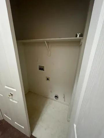 a bathroom with a sink and washing machine