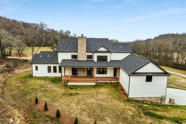 a view of a swimming pool with mountains in the background