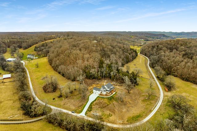 a view of a swimming pool with a chair and floor