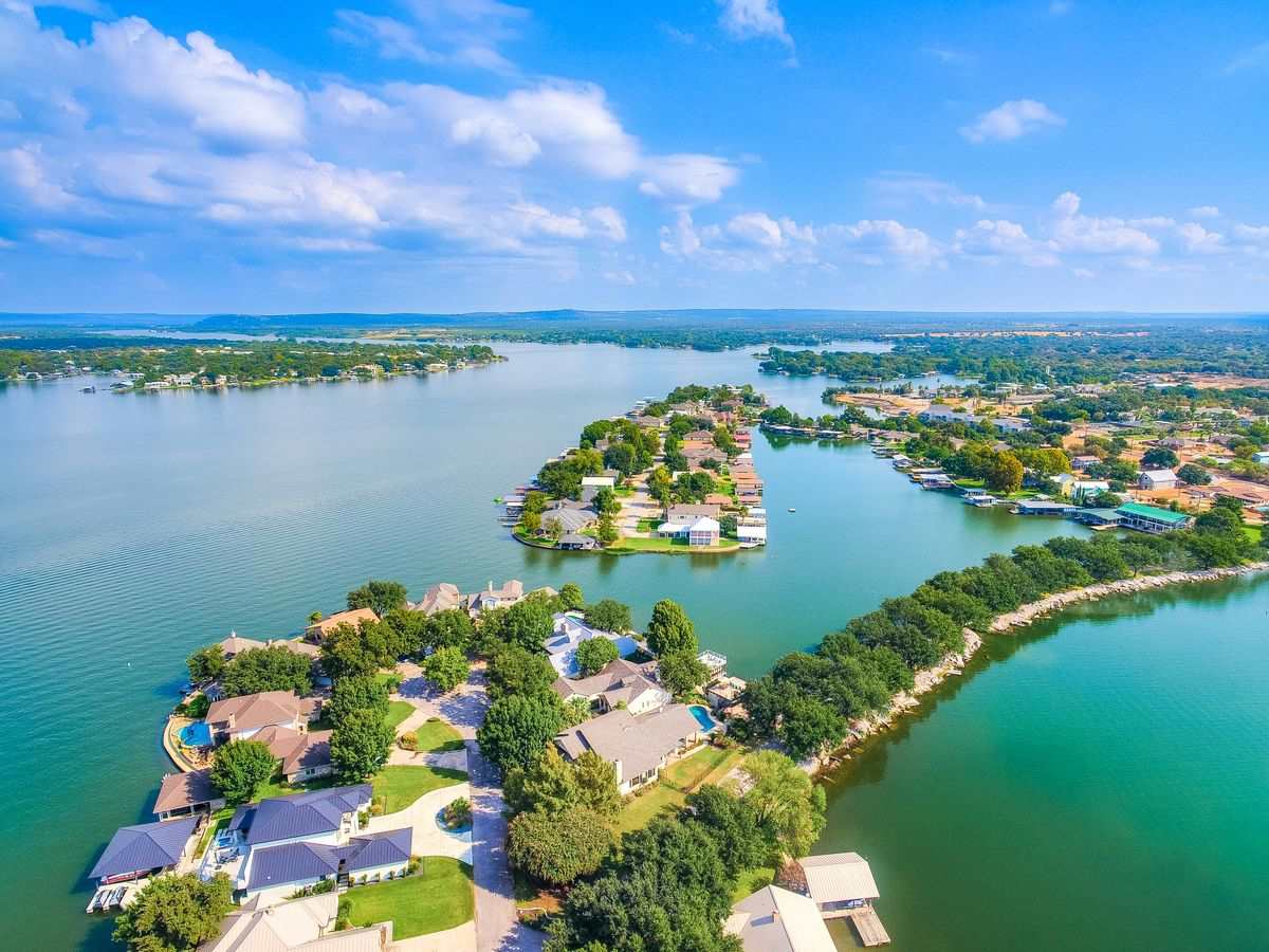 a view of a lake with a city