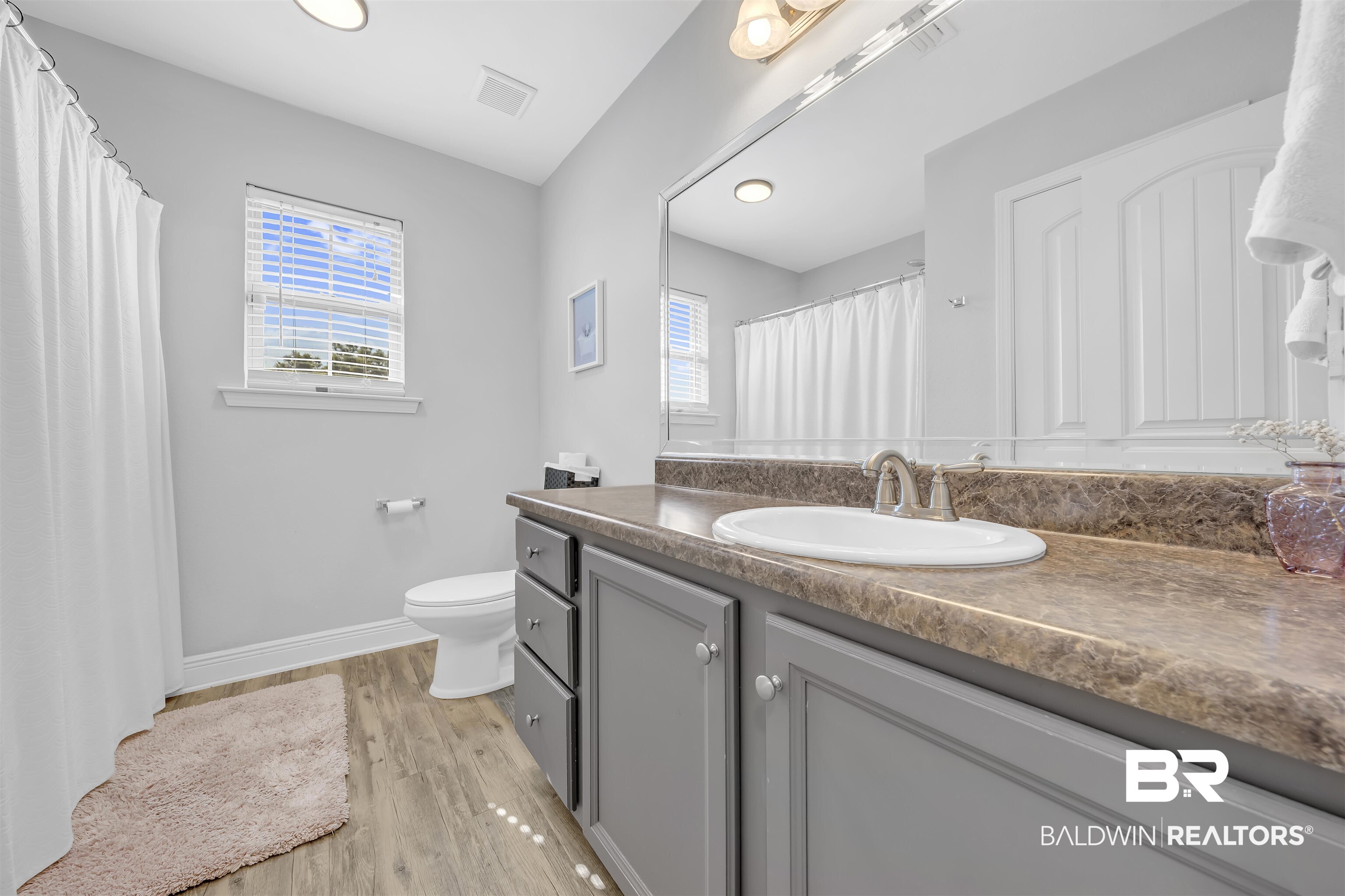 15570 Medway Court Foley, AL 36535 - Photo 15 of 25 Bathroom featuring vanity, light wood finished floors, recessed lighting, and a shower with curtain