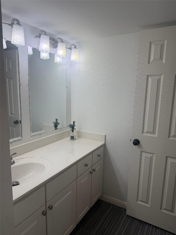 3600 Jeanetta Street, Unit 804 Houston, TX 77063 - Photo 15 of 26 a bathroom with a sink a light fixture and a mirror