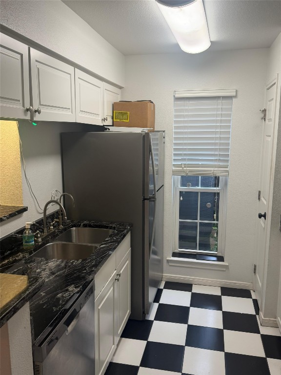3600 Jeanetta Street, Unit 804 Houston, TX 77063 - Photo 22 of 26 a kitchen with granite countertop stainless steel appliances a sink and cabinets