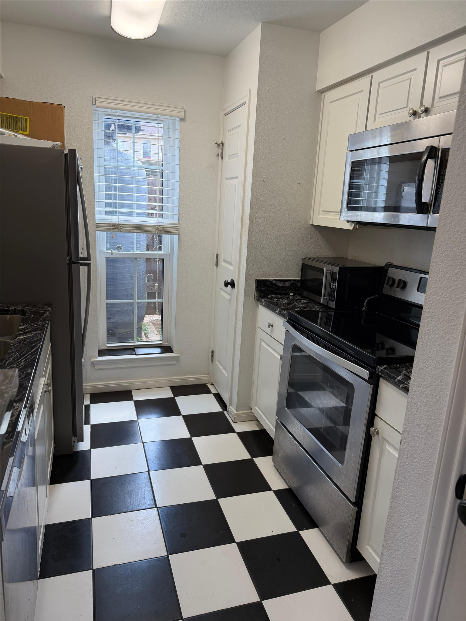 3600 Jeanetta Street, Unit 804 Houston, TX 77063 - Photo 3 of 26 a black and white checkered floor with a black white checkered floor