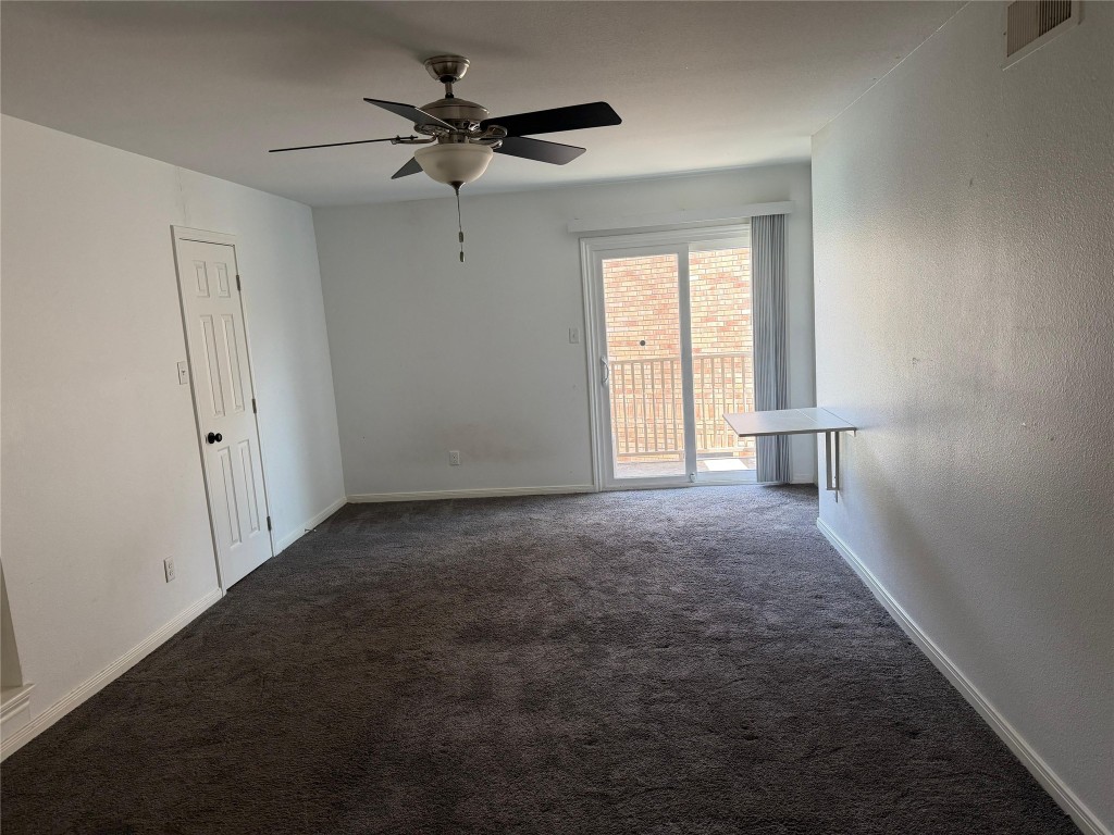 3600 Jeanetta Street, Unit 804 Houston, TX 77063 - Photo 8 of 26 a view of a livingroom with a ceiling fan and window