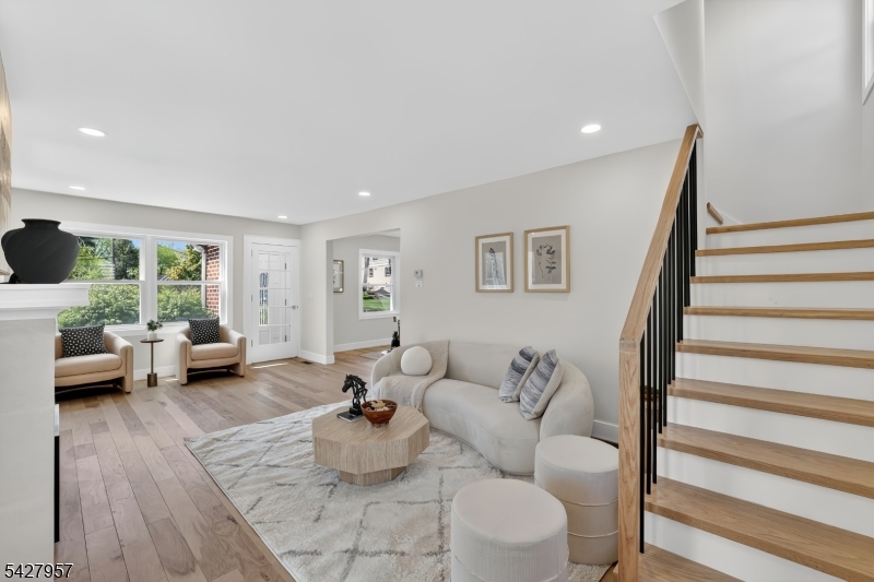 909 Ridgewood Road Millburn, NJ 07041 - Photo 5 of 33 a living room with furniture and a wooden floor