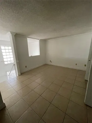 a bathroom with a granite countertop sink a toilet and vanity