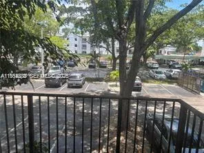 a view of a house with pool and chairs