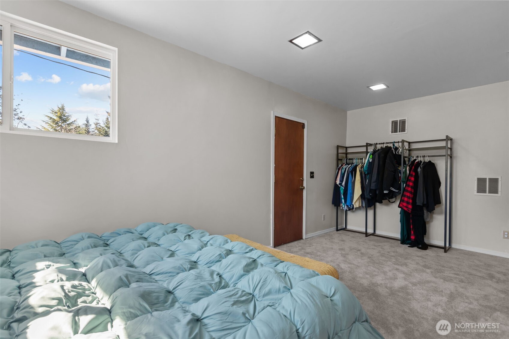 16022 126th Avenue Southeast Renton, WA 98058 - Photo 11 of 35 a bed room with a bed and a mirror
