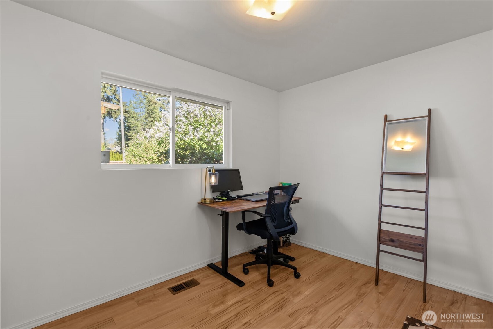 16022 126th Avenue Southeast Renton, WA 98058 - Photo 13 of 35 a view of a workspace with furniture and a window